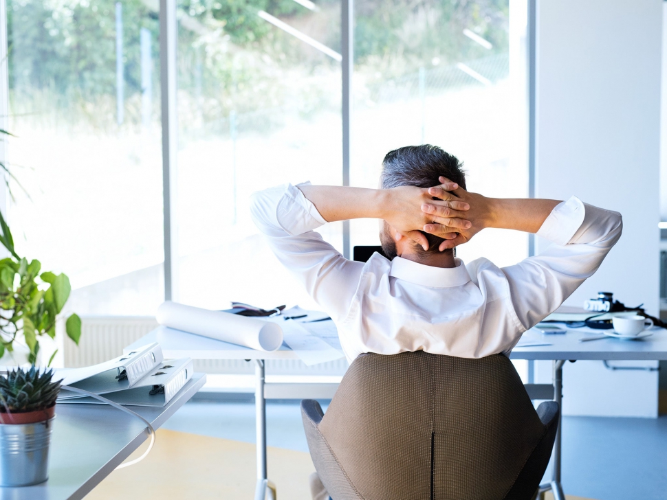 Businessman-at-the-desk-in-his-office-resting.ee44-min